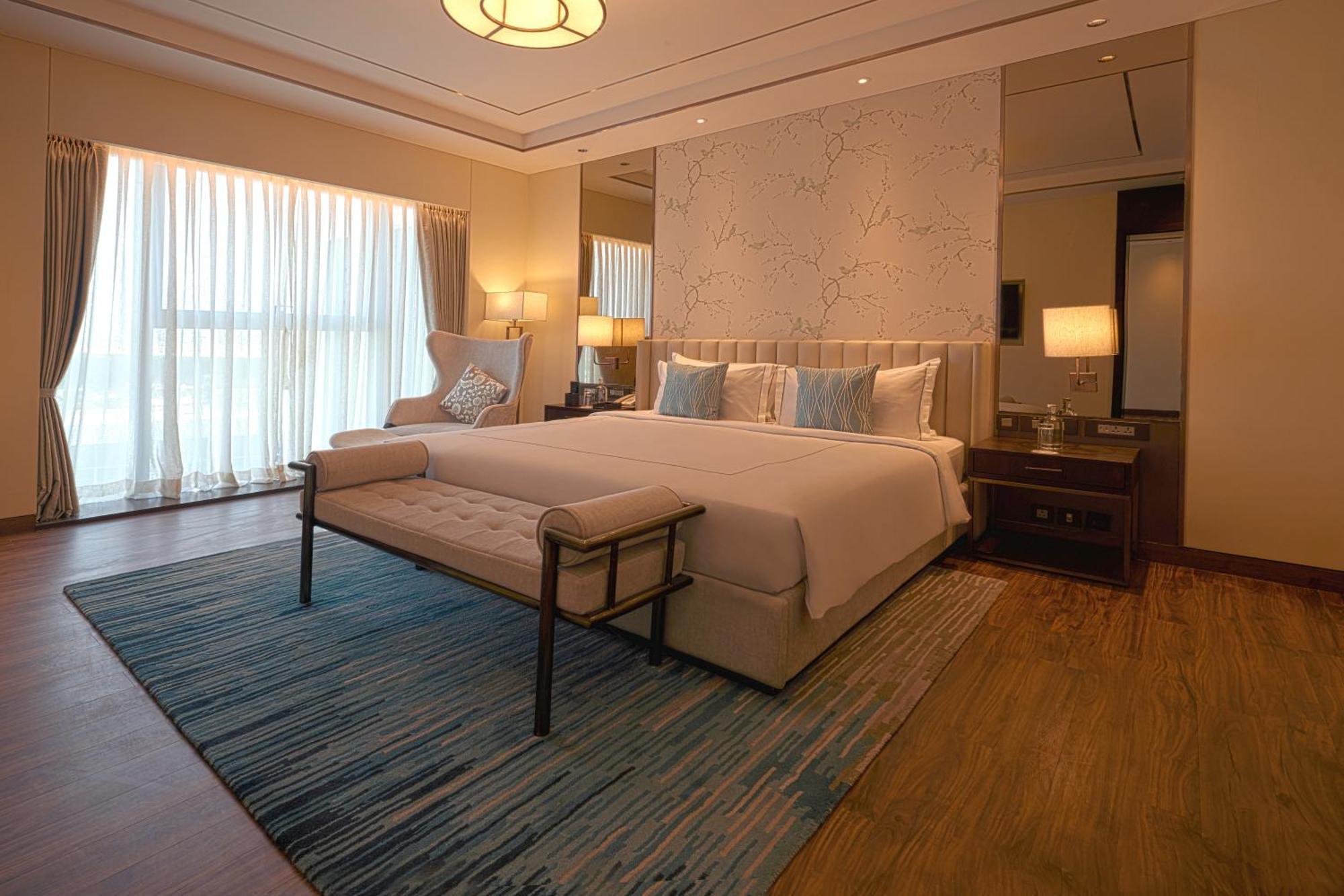 ทัช บังกะลอร์ Hotel Devanahalli ภายนอก รูปภาพ A bedroom at the hotel