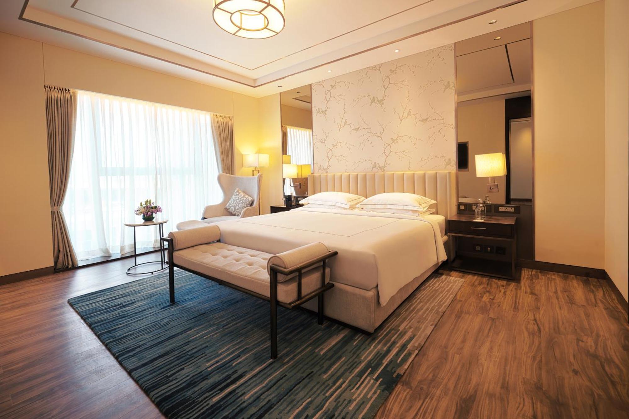 ทัช บังกะลอร์ Hotel Devanahalli ภายนอก รูปภาพ A bedroom at the hotel